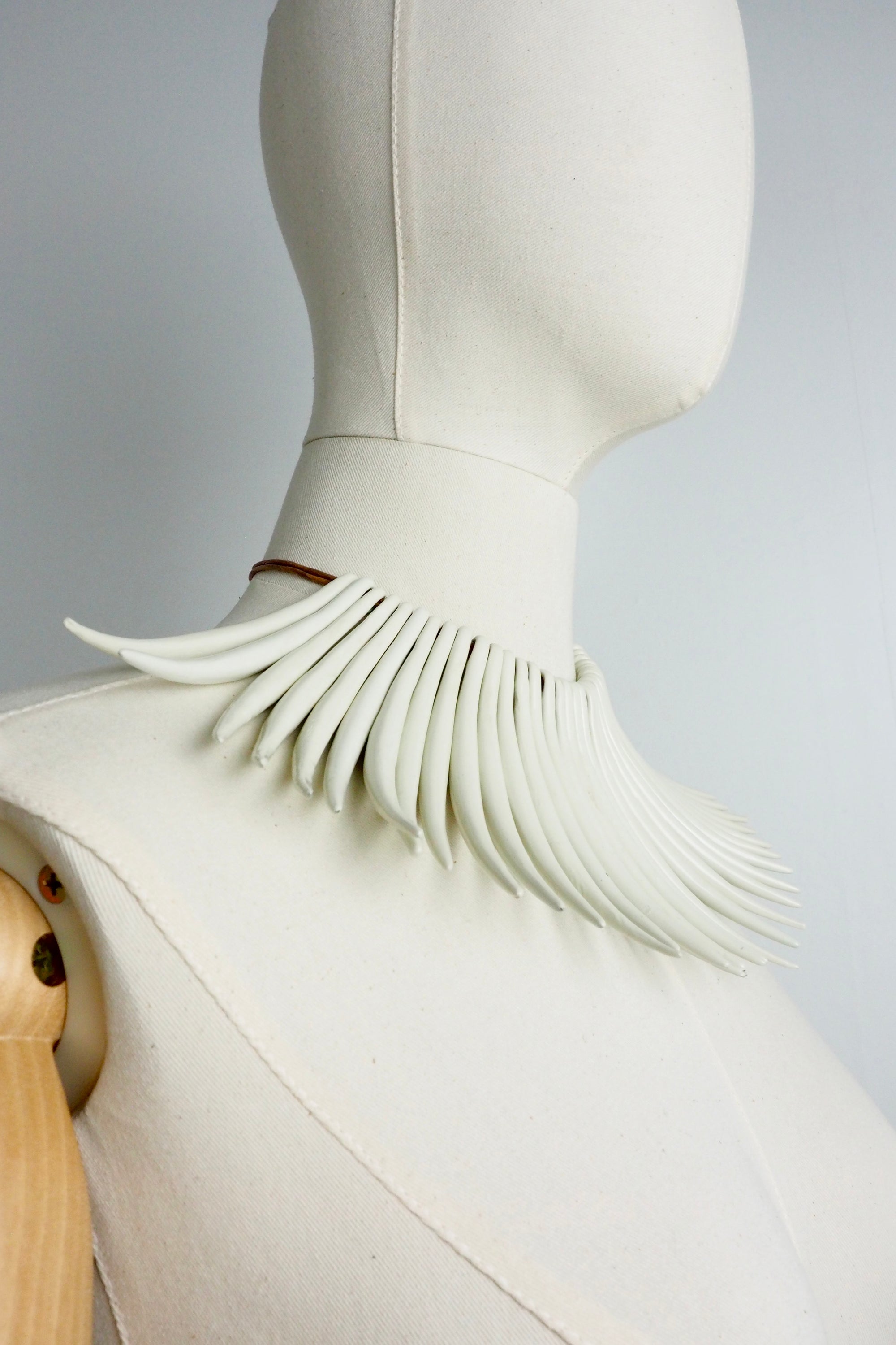 SASS AND BIDE 2011 "The flying Machine" tusk necklace.